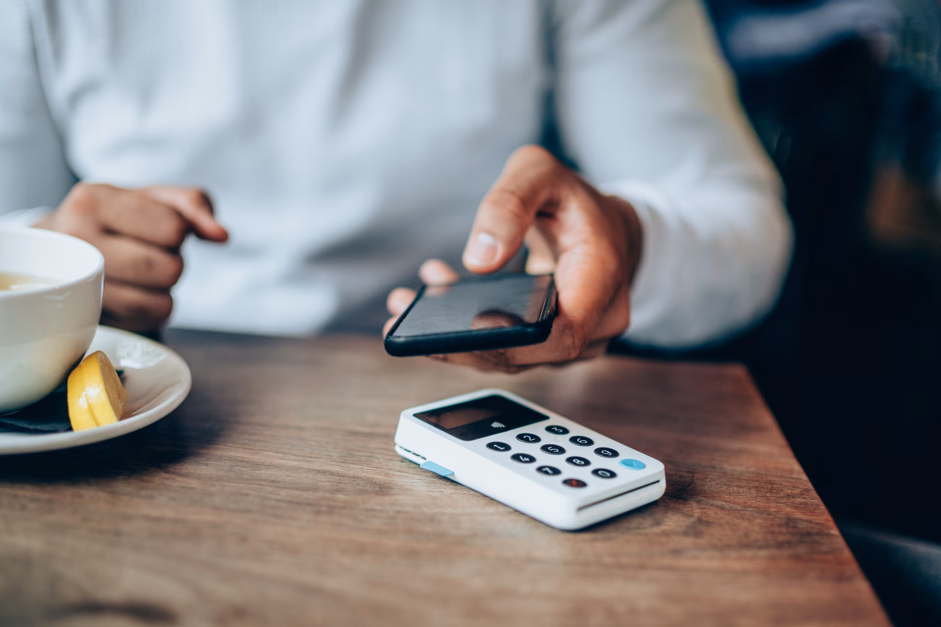 Man paying with a mobile phone